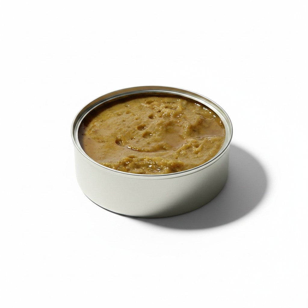 Tinned Fins José Gourmet codfish and parsley pâté in an open round metal tin on a white background
