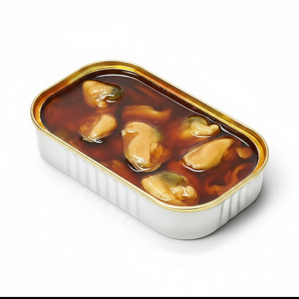 Tinned Fins José Gourmet fried mussels in a rich dark marinade inside an open rectangular metal tin